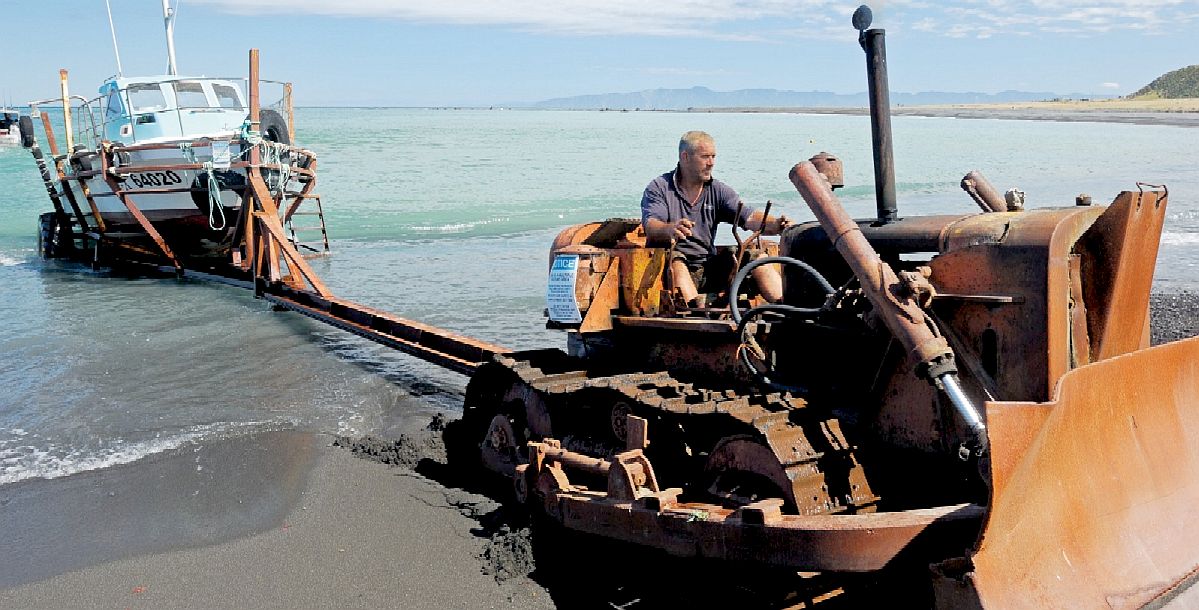 Ngawi in New Zealand, where the fishermen use tractors to launch and retrieve fishing boats